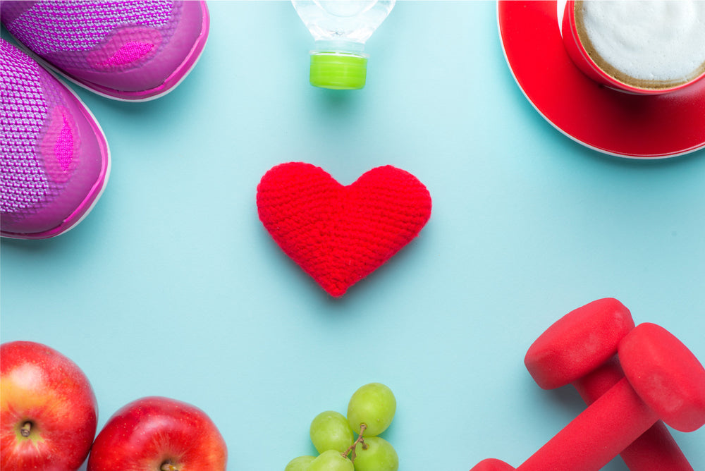 Heart surrounded by fitness objects