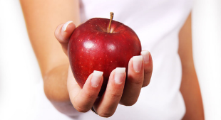 Hand holding apple