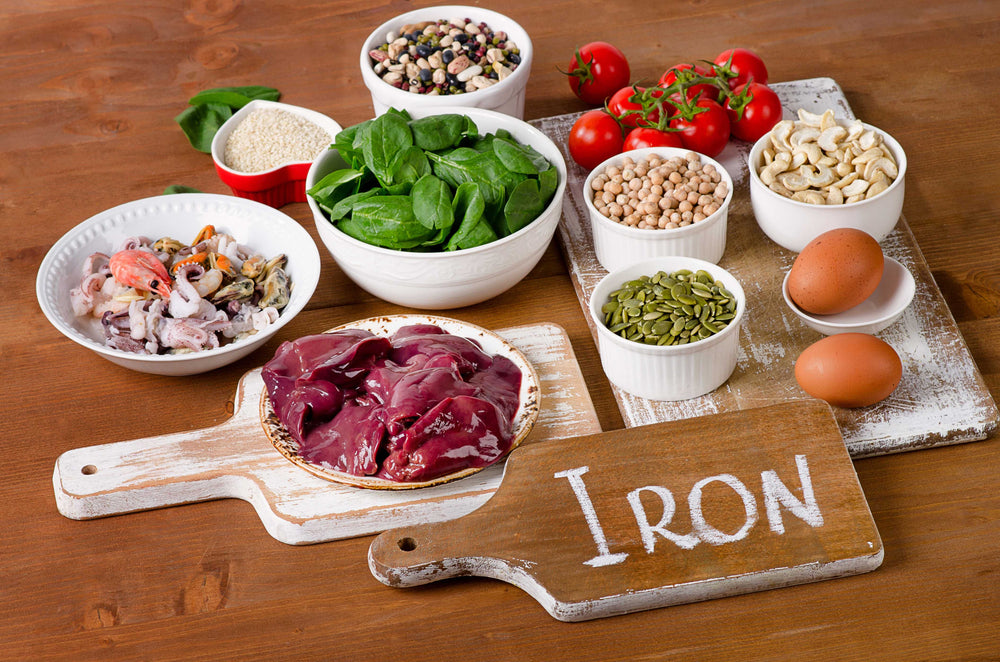 "Iron" written on a board surrounded by food A
