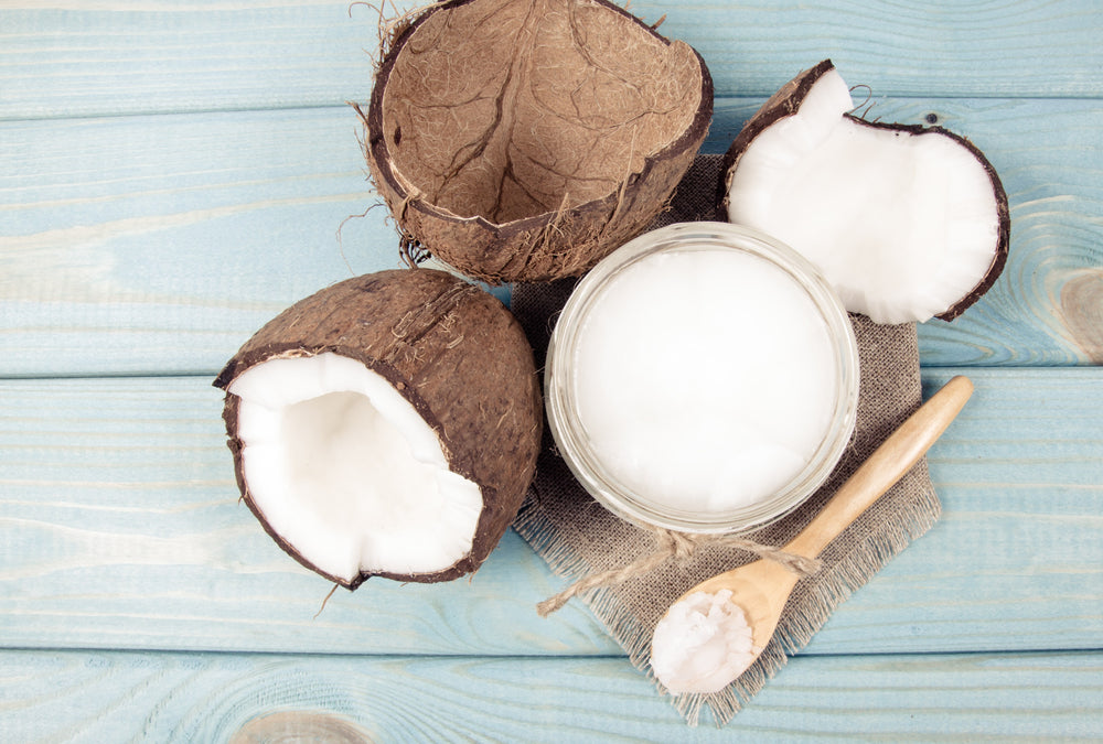 Coconuts and a bowl of coconut oil A